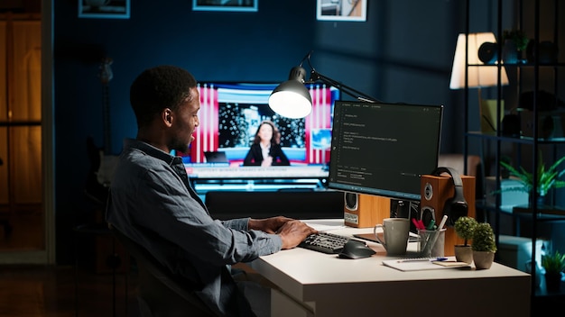 Free Photo african american expert at desk using pc for programming and data analysis