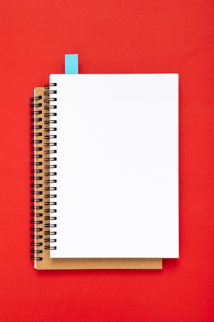 Free Photo arrangement of desk elements with empty notebooks