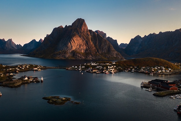 Free Photo breathtaking shot of the mountainous landscape with the ocean captured in reine, norway
