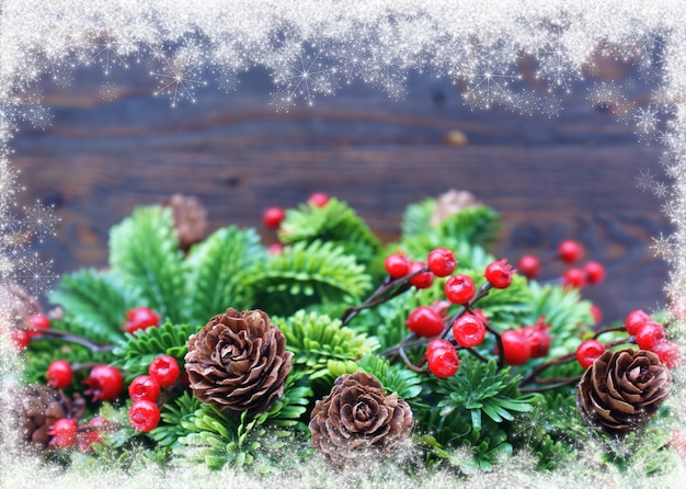 Free Photo christmas background with pinecone and mistletoe