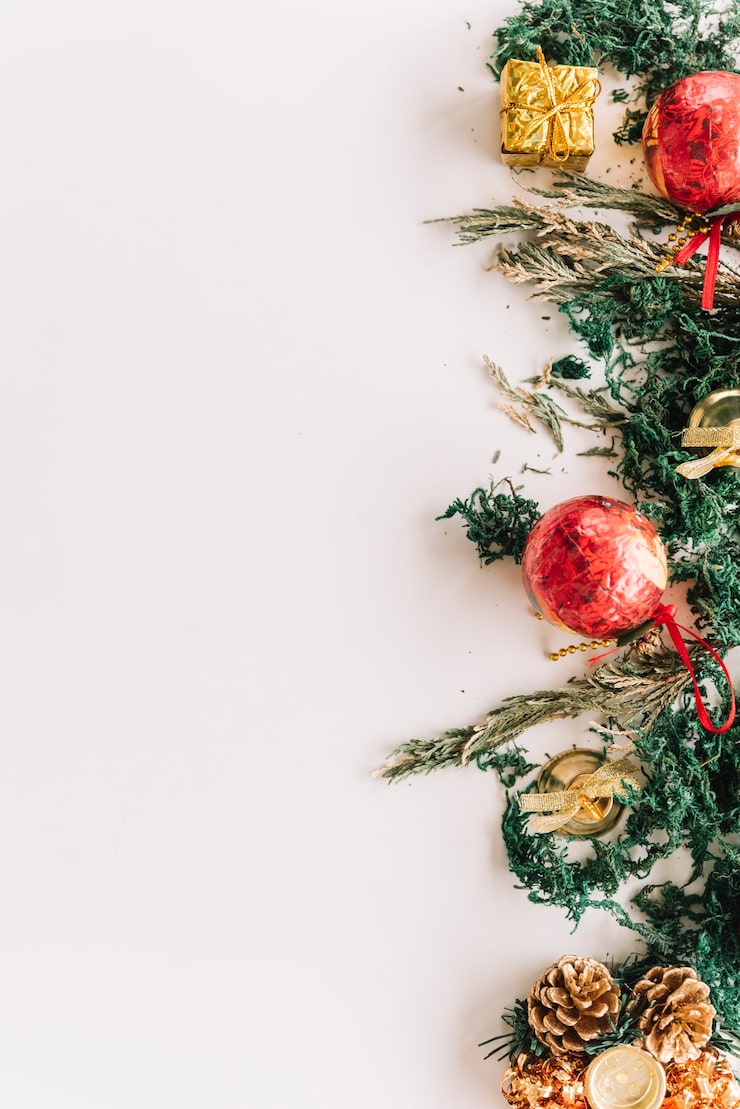 Free Photo christmas composition of spruce branches with baubles