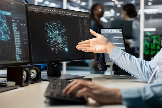 Free Photo close up of programmer looking at computer monitor in data center running scripts