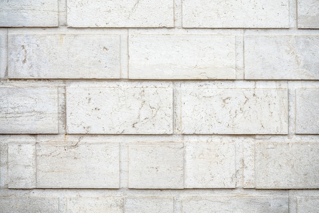 Free Photo closeup shot of a wall made of white rectangular stones background