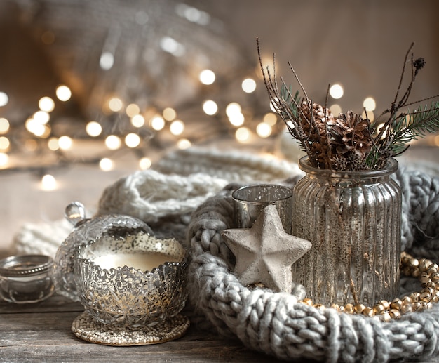 Free Photo cozy christmas composition with candles in a decorative candlestick. the concept of home comfort and warmth.