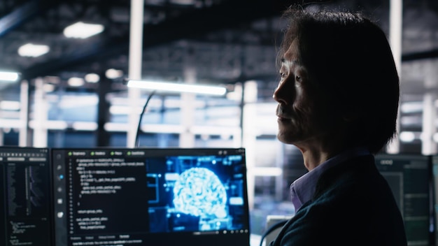 Free Photo data center software developer using computer to monitor neural network ai llm