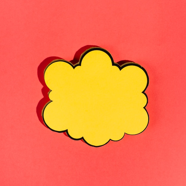 Free Photo empty yellow speech bubble on red background