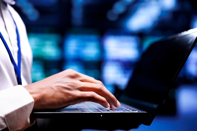 Free Photo expert servicing server rows with high computing power enabling hyperscale data center to support demanding applications, including artificial intelligence and neural network workloads