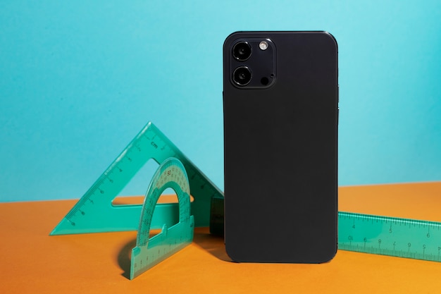 Free Photo front view of smartphone with geometry tools