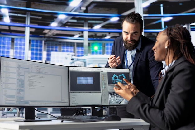 Free Photo happy photovoltaics factory programmer coding presenting progress to manager