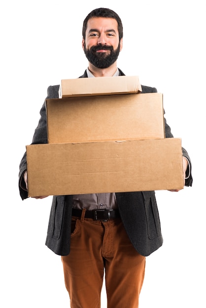 Free Photo man holding boxes