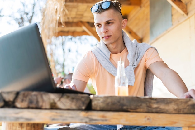 Free Photo medium shot freelancer sitting at table