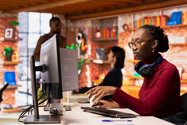 Free Photo programmer in startup office using large language model to get help with coding