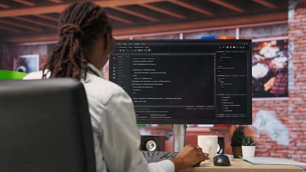 Free Photo programmer types code into pc entering commands running script