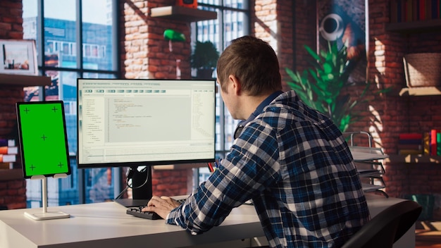 Free Photo software engineer at pc coding creating software using isolated screen tablet