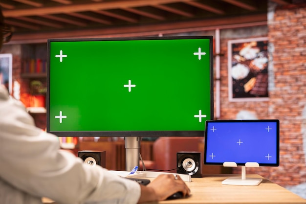 Free Photo teleworker inputting data on isolated screen devices completing spreadsheets