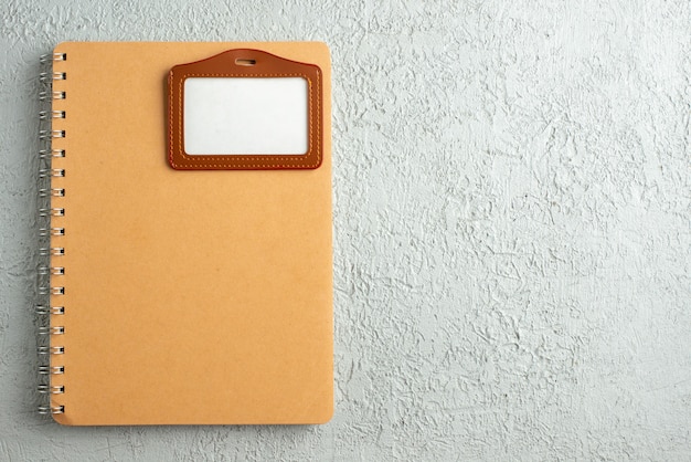 Free Photo top view of notebook and label