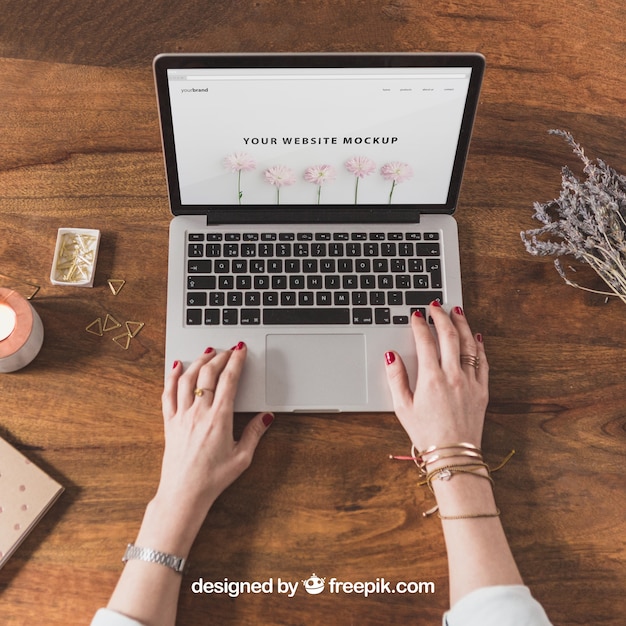 Free PSD female hands on laptop