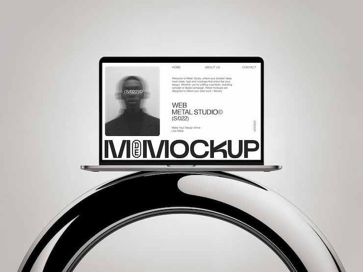 Free PSD laptop mockup on chrome stand
