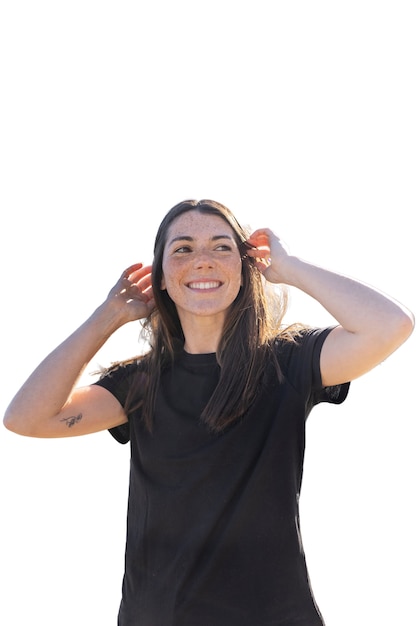 Free PSD medium shot woman putting her hair behind her ears