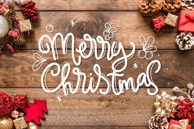 Free Vector merry christmas lettering on christmas photo