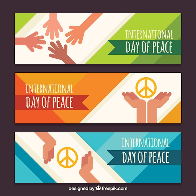 Free Vector set of peace day banners with hands in flat design