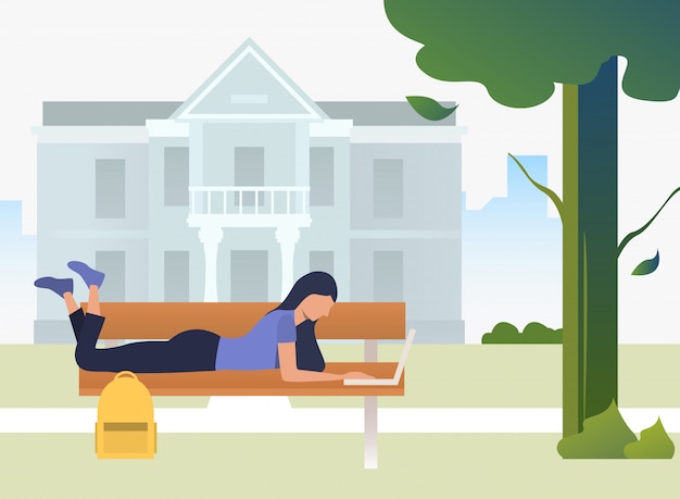 Free Vector student studying, using laptop and lying on bench in campus park