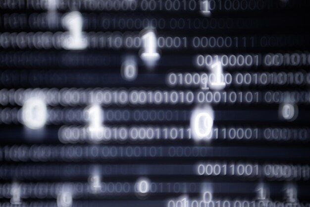 Photo abstract big data image computer display screen with binary code moving in the background