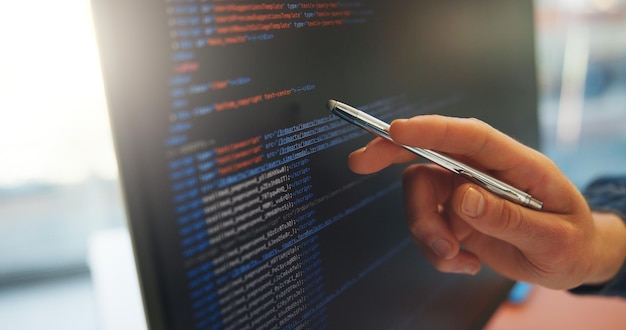 Photo analyze code or hand in office with computer screen software error or data check in debug process programming man or system analyst in agency with pen performance or log review for best practice