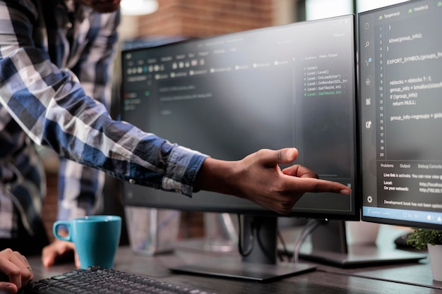 Photo blockchain engineer pointing out mistake in network security software line code. cybernetics developers engineering system updates and processing data blocks uploaded by artificial intelligence.