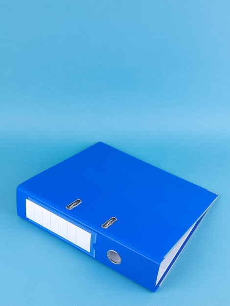 Photo blue office folder on blue background office folder template