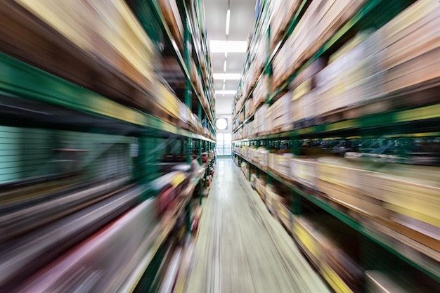 Photo blurred motion of forklift inside a warehouse