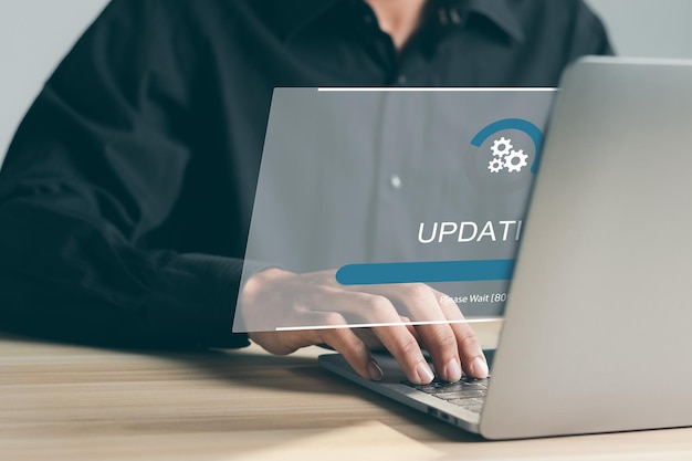 Photo businessman working and installing update process software update or operating system upgrade to keep the device up to date with added functionality in new version and improve security