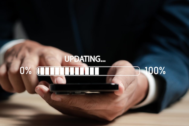 Photo businessman working and installing update process software updates or operating system upgrades to keep your device up to date with enhanced functionality in new versions and improved security