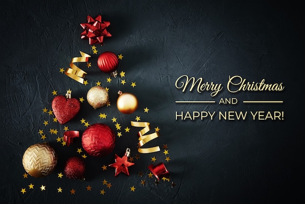 Photo christmas tree made of red and golden baubles and festive ribbons