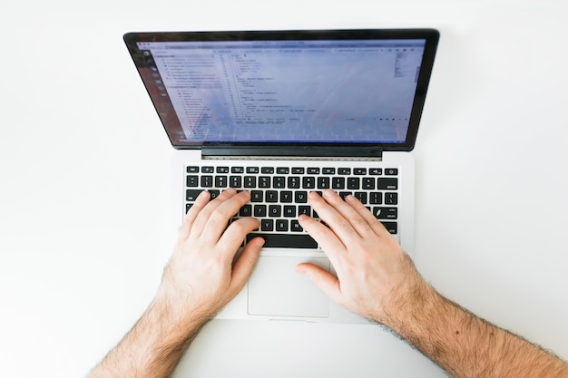 Photo closeup coding on screen, man hands coding html and programming on screen laptop, development web, developer