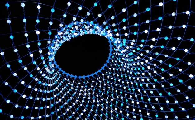Photo colorful lights in a circle shaped net