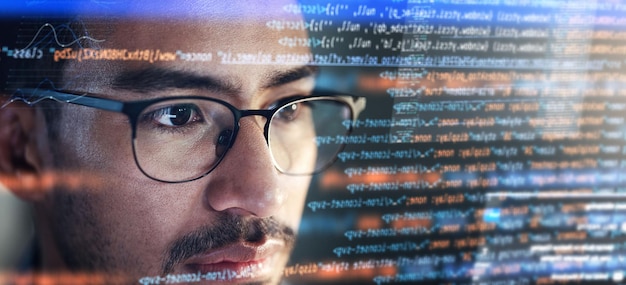 Photo computer coding hologram and man in data analytics information technology overlay or html at night programmer or it person in glasses reading software script programming or cybersecurity research