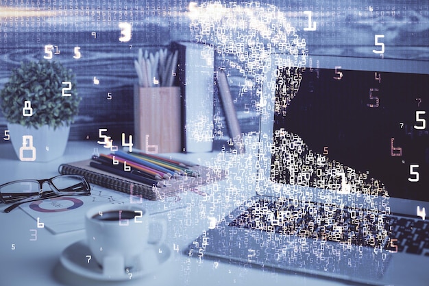 Photo computer on desktop in office with technology theme hologram double exposure tech concept