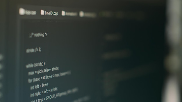 Photo computer monitor with developing programming and coding technology to create new user interface app in it agency office. database code to check algorithm and plan security system. close up.