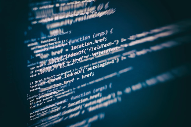 Photo developer programming code. abstract computer script code. programming code screen of software developer. software programming work time.