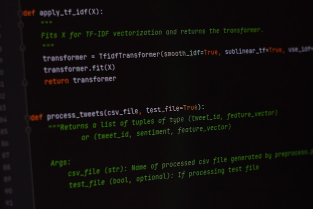 Photo developer python, java script, html, css source code on monitor screen. writing script of software developer. program coding. programmer editing code background. technology background close up shot.