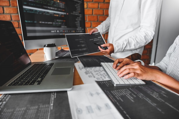 Photo developing programmer reading computer codes development website design and coding technologies.