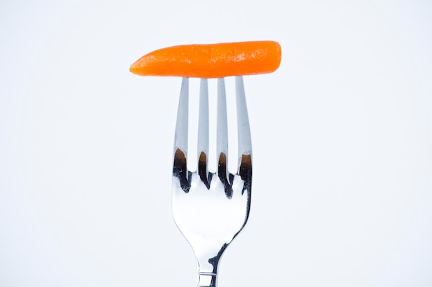 Photo diet, carrot bite in a fork