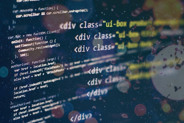 Photo digital technology on display. html5 in editor for website development. website html code on the laptop display closeup photo.