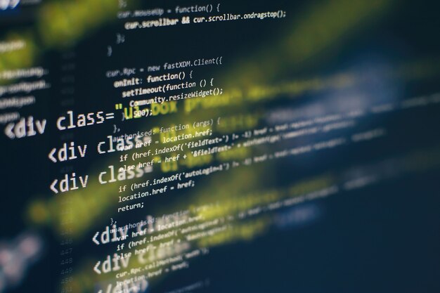 Photo digital technology on display. html5 in editor for website development. website html code on the laptop display closeup photo.