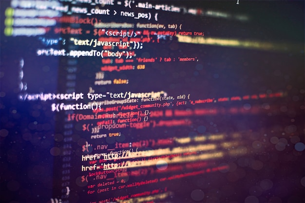 Photo digital technology on display. html5 in editor for website development. website html code on the laptop display closeup photo.