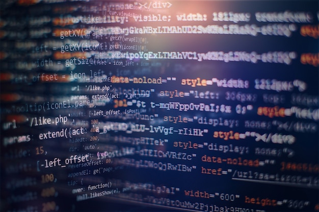 Photo digital technology on display. html5 in editor for website development. website html code on the laptop display closeup photo.