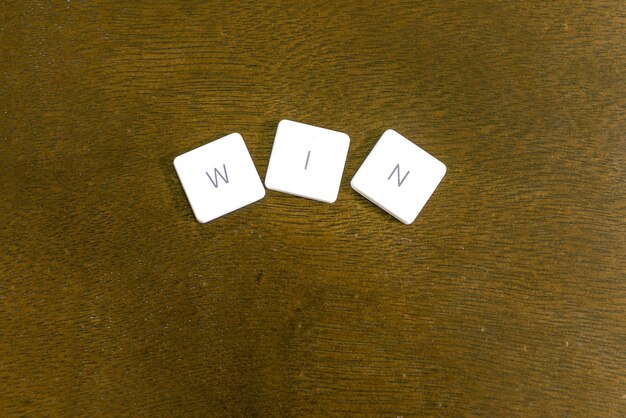 Photo directly above shot of win text on table