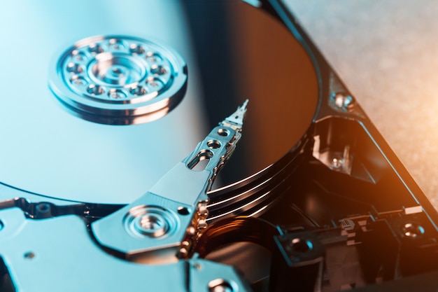 Photo disassembled hard drive from the computer, hdd with mirror effect