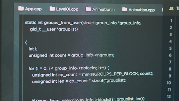 Photo display of software developer typing database functions script on html terminal window in it agency office. computer showing programer writing source code and developing app. close up.